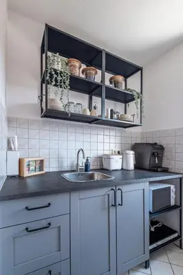 Küche/Küchenzeile in der Unterkunft Modernes Apartment am Campus - Parken - Smart-TV - Kaffeevollautomat