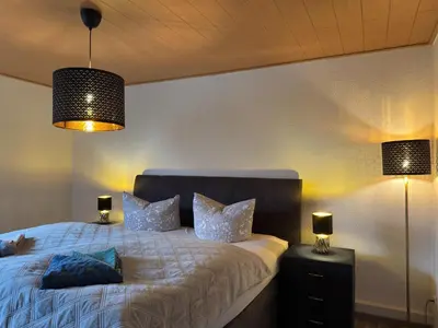 Ein Bett oder Betten in einem Zimmer der Unterkunft Ferienhaus mit Kamin in Thale-Friedrichsbrunn
