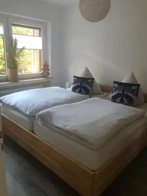 Ein Bett oder Betten in einem Zimmer der Unterkunft Ferienwohnung Waschbärglück