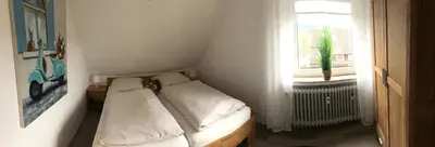 Ein Bett oder Betten in einem Zimmer der Unterkunft Ferienwohnung Eichhörnchenkobel
