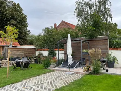 Ein Garten an der Unterkunft Gemütliche Ferienwohnung