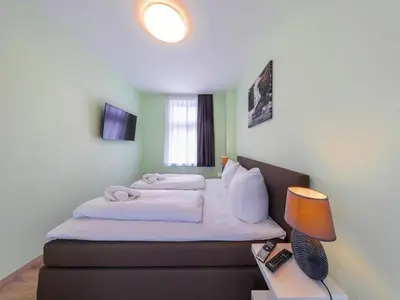 Ein Bett oder Betten in einem Zimmer der Unterkunft Apartment Remise, Wernigerode