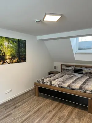 Ein Bett oder Betten in einem Zimmer der Unterkunft Mompels