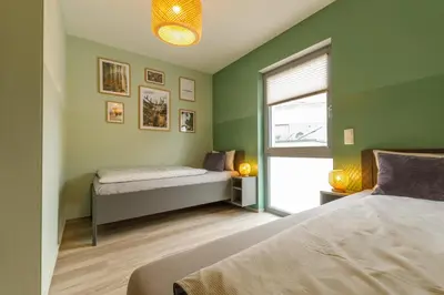 Ein Bett oder Betten in einem Zimmer der Unterkunft Lindenberg Apartments
