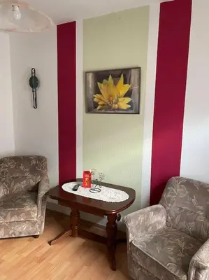 Ein Sitzbereich in der Unterkunft Quartier für zwei