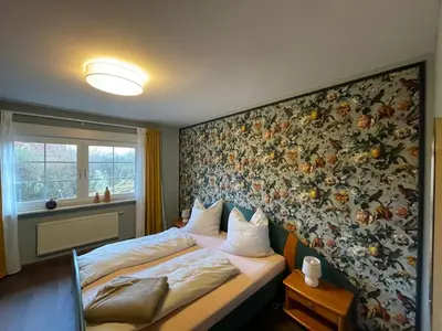 Ein Bett oder Betten in einem Zimmer der Unterkunft Familienurlaub im Grünen