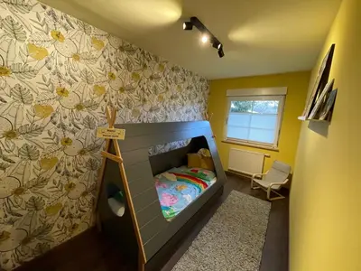 Ein Bett oder Betten in einem Zimmer der Unterkunft Familienurlaub im Grünen