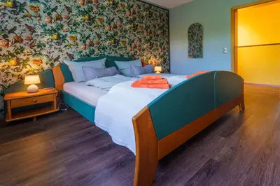 Ein Bett oder Betten in einem Zimmer der Unterkunft Familienurlaub im Grünen