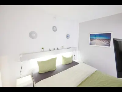 Ein Bett oder Betten in einem Zimmer der Unterkunft NEU! FeWo Panoramablick Hohegeiß Pool und Sauna