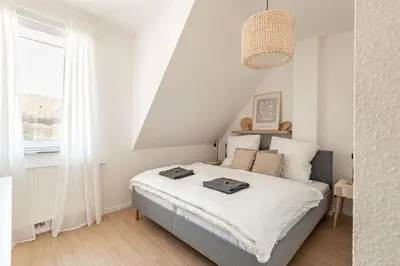 Ein Bett oder Betten in einem Zimmer der Unterkunft Premium Apartment - Ausblick - Kamin - Balkon - Smart TV - Kaffeevollautomat