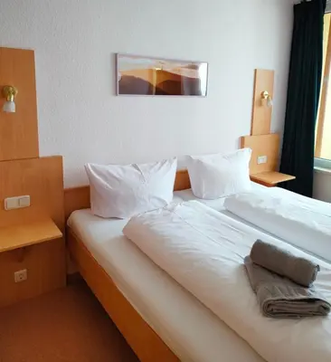 Ein Bett oder Betten in einem Zimmer der Unterkunft Apartment Brockenblick mit tollen Blick und Schwimmbad
