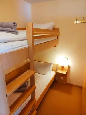 Ein Bett oder Betten in einem Zimmer der Unterkunft Apartment Brockenblick mit tollen Blick und Schwimmbad