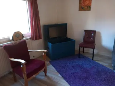 Ein Sitzbereich in der Unterkunft Het huisje
