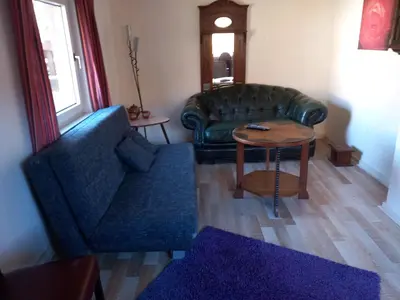 Ein Sitzbereich in der Unterkunft Het huisje