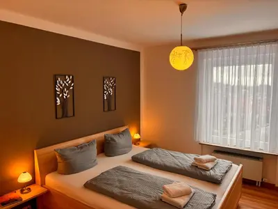 Ein Bett oder Betten in einem Zimmer der Unterkunft Ferienwohnung Landgraf