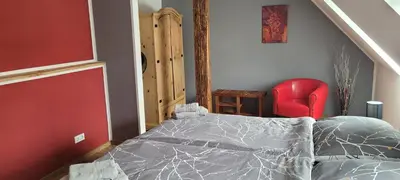 Ein Bett oder Betten in einem Zimmer der Unterkunft HarzRitter Domizil
