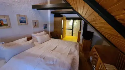 Ein Bett oder Betten in einem Zimmer der Unterkunft Hexenhütte