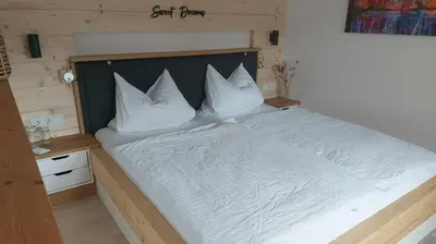 Ein Bett oder Betten in einem Zimmer der Unterkunft Ferienwohnung Häusli