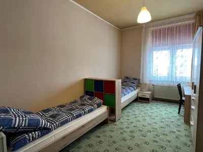 Ein Bett oder Betten in einem Zimmer der Unterkunft Family Apartments Thale