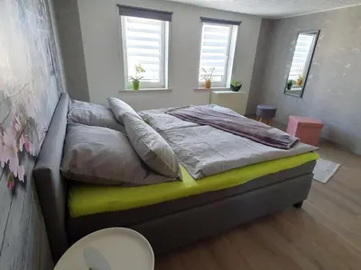 Ein Bett oder Betten in einem Zimmer der Unterkunft Ferienwohnung Kopp