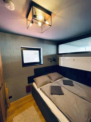 Ein Bett oder Betten in einem Zimmer der Unterkunft Harzchalet Emma 2