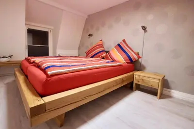 Ein Bett oder Betten in einem Zimmer der Unterkunft Ferienwohnung Ostard 2
