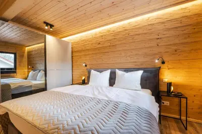 Ein Bett oder Betten in einem Zimmer der Unterkunft Bergwaldchalet Tierfreund