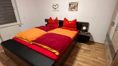 Ein Bett oder Betten in einem Zimmer der Unterkunft Ferienwohnung Le Petit