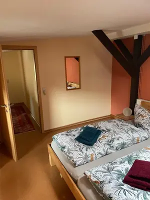 Ein Bett oder Betten in einem Zimmer der Unterkunft Zur zornigen Ameise