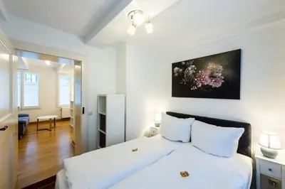 Ein Bett oder Betten in einem Zimmer der Unterkunft Ferienwohnung 1 - Marktkirchhof