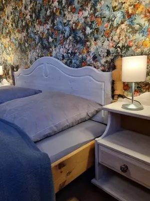 Ein Bett oder Betten in einem Zimmer der Unterkunft FERIENHAUS ZUM HOLZMICHEL