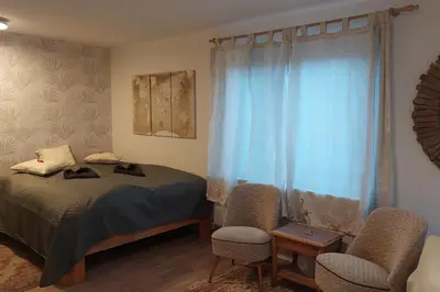 Ein Bett oder Betten in einem Zimmer der Unterkunft Günstige, schöne Ferienwohnung im Wanderparadies