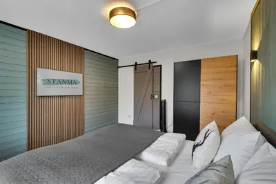 Ein Bett oder Betten in einem Zimmer der Unterkunft STANMA Hirschtraum für 7 Personen mit 3 Schlafzimmern