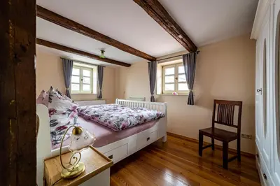 Ein Bett oder Betten in einem Zimmer der Unterkunft Ferienhaus Sankt Marien auf dem Münzenberg